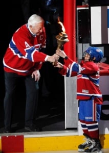 Jean Beliveau to lie in state at Bell Centre, given national funeral 3 Montreal Canadiens legend Jean Beliveau passes a torch to a young skater as part the opening ceremony before the start a playoff game between between the Montreal Canadiens and Boston Bruins Monday, April 18, 2011.