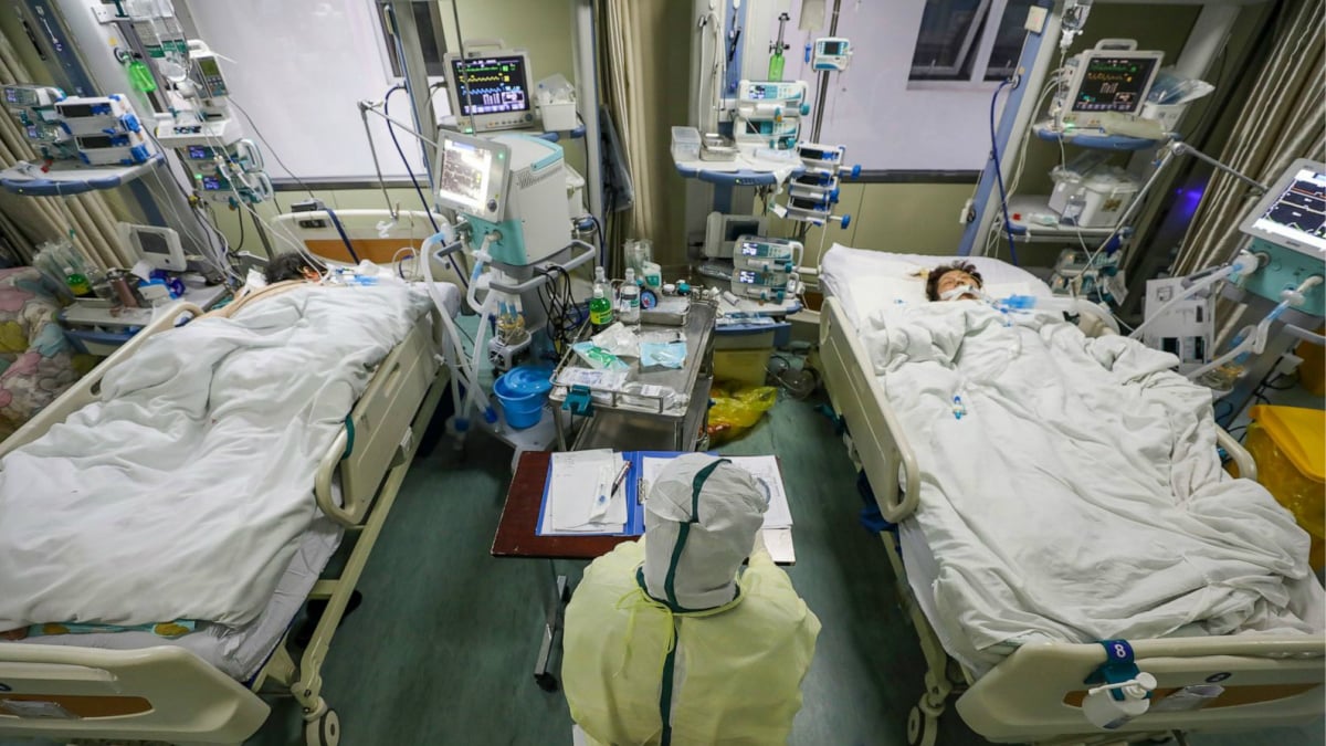 China's virus death toll surpasses SARS but new cases fall